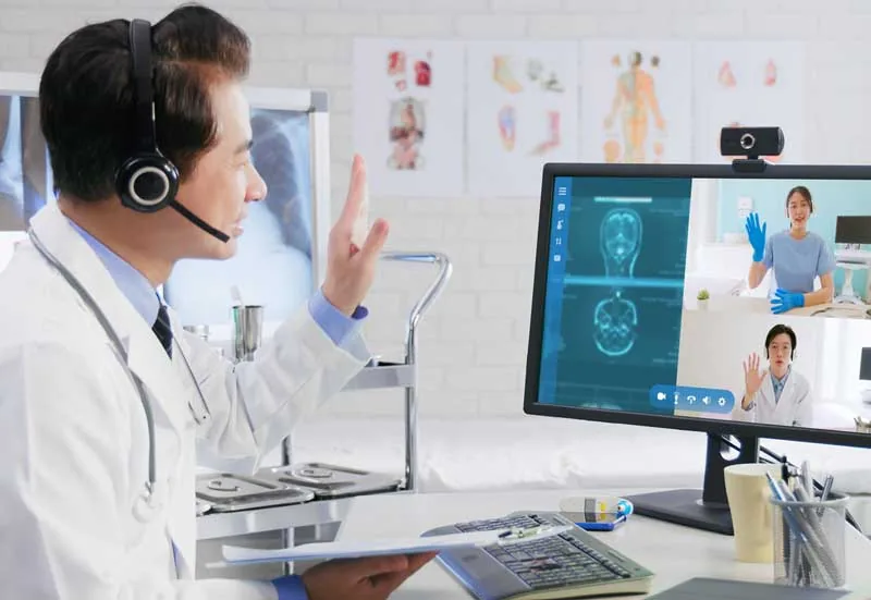 Healthcare virtual assistant working at a computer